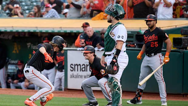 Aug 18, 2023; Oakland, California, USA; Baltimore Orioles infielder Gunnar Henderson (2) celebrates with catcher Adley Rutschman (35) and outfielder Anthony Santander (25) after hitting a two run home run against the Oakland Athletics during the second inning at Oakland-Alameda County Coliseum. Mandatory Credit: Robert Edwards-USA TODAY Sports